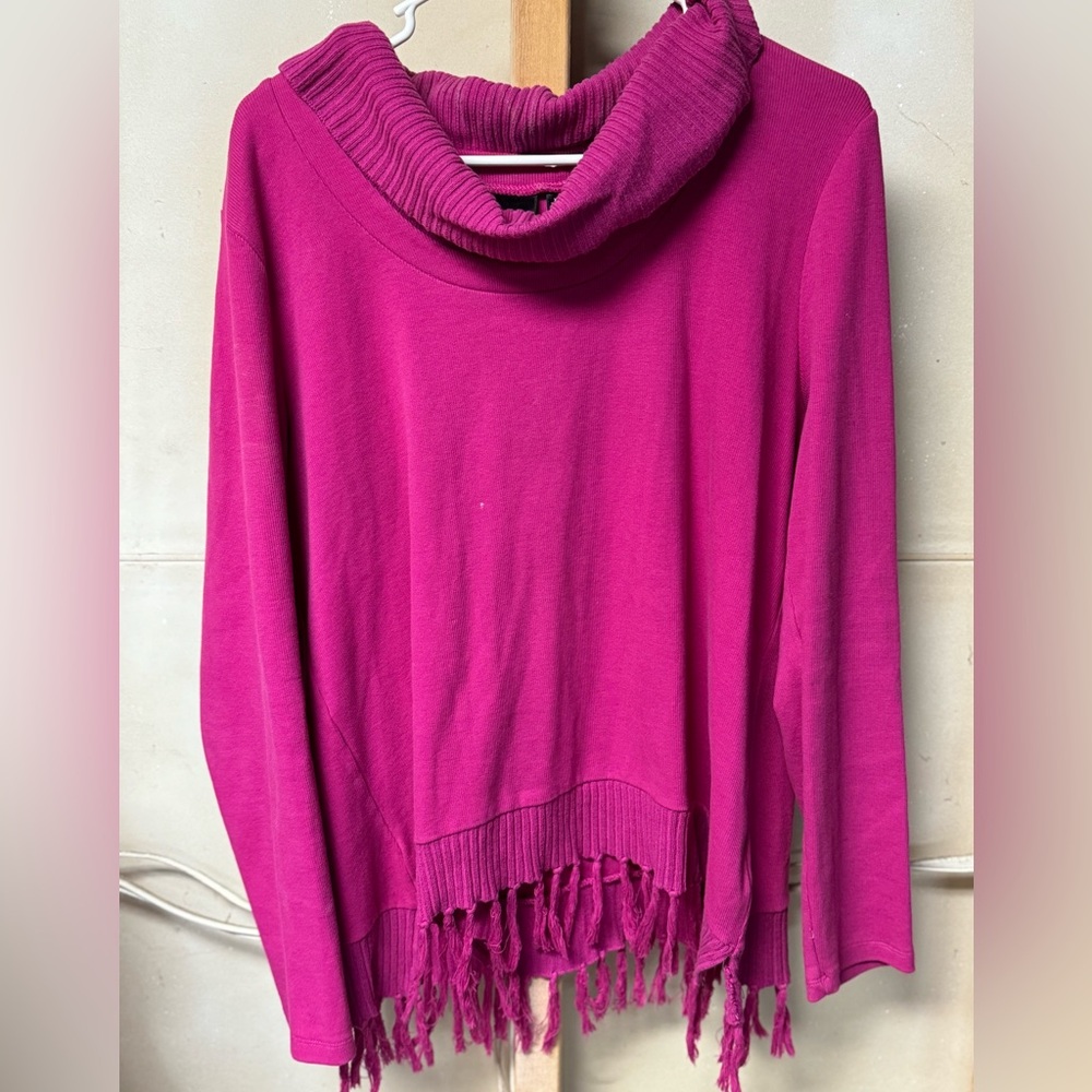 Woman’s pink sweater